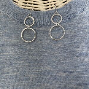 Silver tone circle earrings.